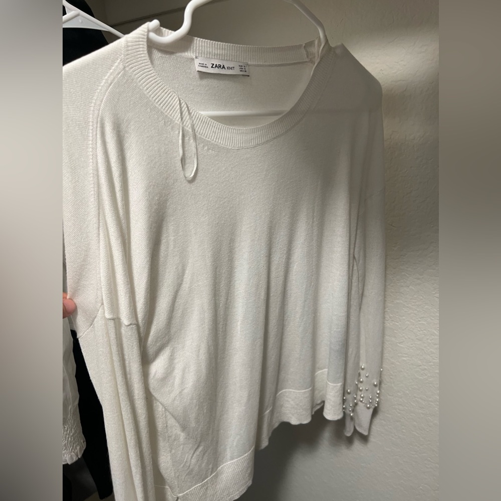White Zara knit long sleeves shirt with pearls alongside the wrists